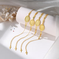 Gold Birthstone Medal and Cross Bracelet